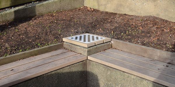 Chess-Board-Inset-Into-Small-Table-on-Wall-Seat